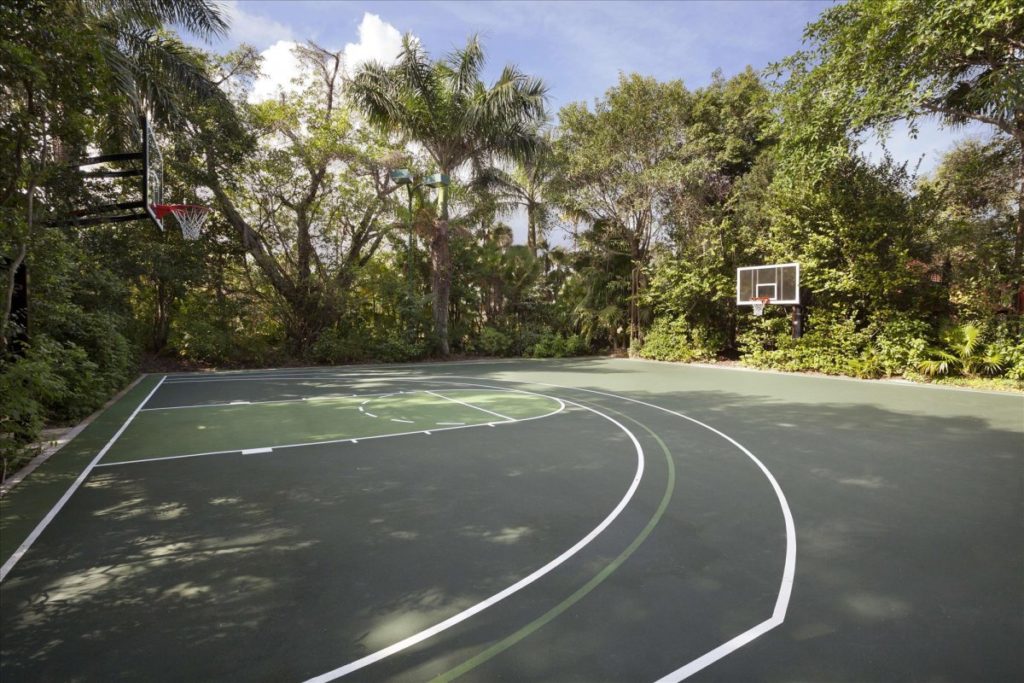 a-half-basketball-court-is-secluded-in-its-own-tropical-forest