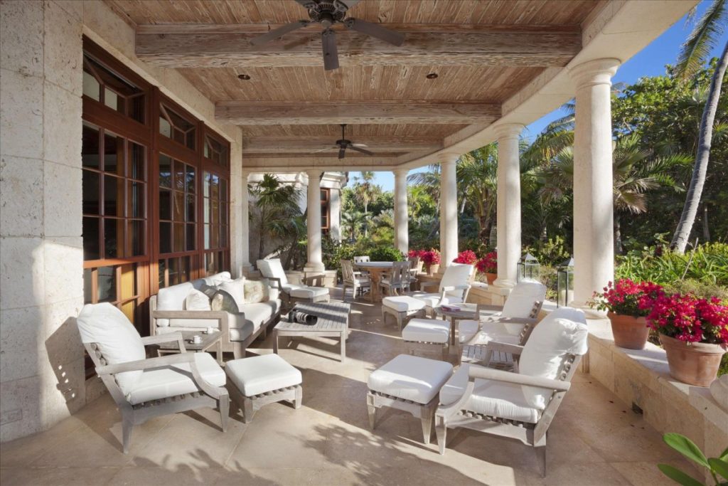 the-look-is-tropical-florida-with-lots-of-dark-woods-natural-coral-shell-stone-marble-and-other-fossil-stones-incorporated-in-the-design